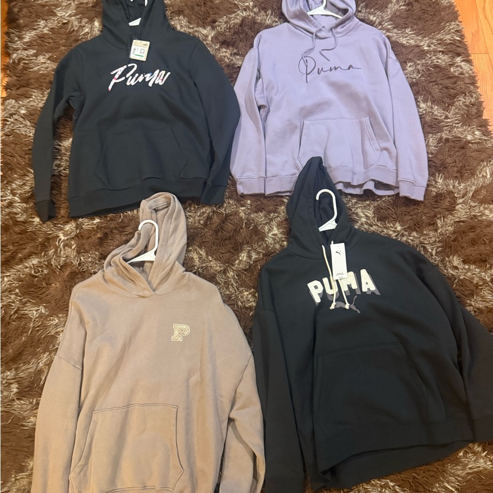 Woman’Puma and 1 Pink Hoodies 2 New Puma and the other 2 are Used size Lg
